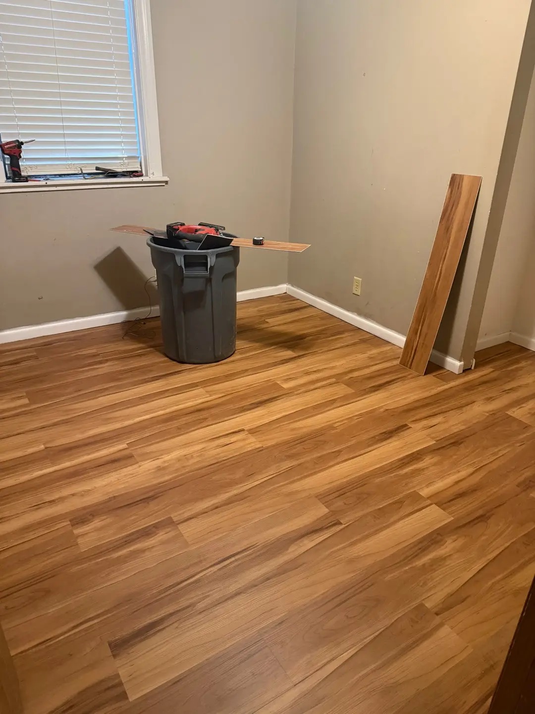 Room after new wood-look flooring installation